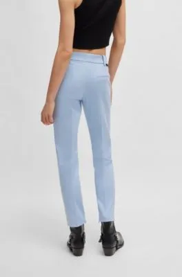 Pantalones tobilleros slim fit con cremallera en la cara interna de los bajos